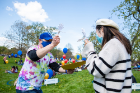 The annual Award's Day event felt more like a pep rally this year, as attendees were handed blue cowbells for COVID-safe cheering and entered the grounds through an archway of blue and white balloons.