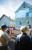 Peter Russell (left) and Ed Steinfeld show students the rear of the house, where the design allows for a lift to be retrofitted to permit aging in place. Photo: Douglas Levere