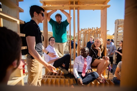 freshman architecture students sit in their full-scale installation. 