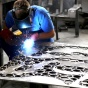 Student welding sheet of metal. 