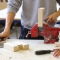 cordless drill, hammer and screwdriver on workbench with a vice. 
