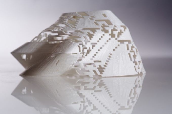 Mountain shaped 3d printed object with a pattern of orthogonal openings. 