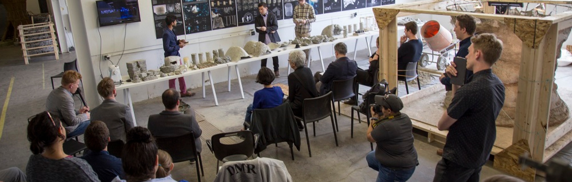students and faculty participate in final reviews of a material culture graduate studio in Parker Hall. 