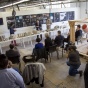 students and faculty participate in final reviews of a material culture graduate studio in Parker Hall. 