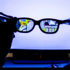 Hi-tech glasses reveal additional information on computer screen. 