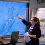 Master of Urban Planning student present their neighborhood plans to a group of community organizers. 