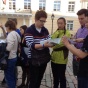 students read map on Estonian street. 