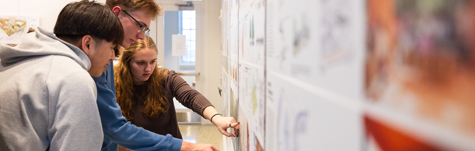 Students review their designs for a resilient campus. 