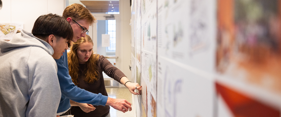 Students review their designs for a resilient campus. 
