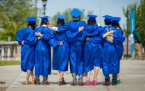 Graduates and their guests take photos near the Abbott Library on South Campus in May 2023. Photographer: Douglas Levere. 