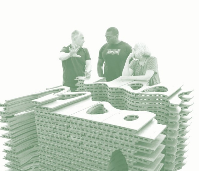 Miguel Guitart, Jalani Lowe, and Laura Garofalo in conversation near terracotta sculpture. 