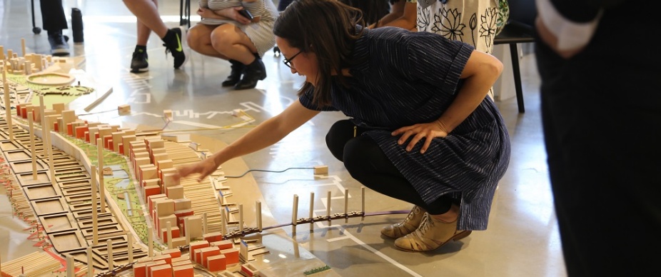faculty and students with a model in studio in Hayes Hall. 