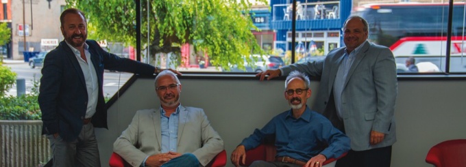 Zoom image: Kideney Architects’ leadership team in their new office in downtown Buffalo: (from left to right), Timothy Kupinski, Raymond Bednarski, Joseph Lenahan and Anthony Gorski. Photo by Mahan Mehrvarz (MArch ‘16) 