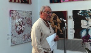 Zoom image: Internationally noted architect and Dean Emeritus Bruno Freschi welcomes guests at the recent opening of his “Flesh and Flags” exhibition in Vancouver, British Columbia. Photo by Bob Warick 