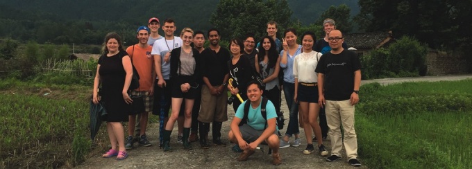 Zoom image: Shannon Bassett, assistant professor of architecture (left), with her students and renowned Chinese filmmaker and artist Ou Ning (right) in China’s Bishan village, one of several sites visited by the studio this past summer. 