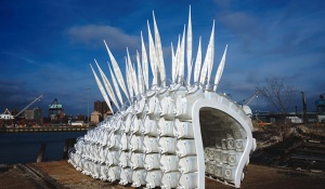 Image of a white shelter with quills on top. 