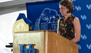Photograph of Micaela Barker giving a speech at the opening ceremony. 