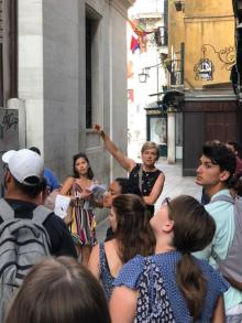 Zoom image: Clinical Associate Professor Kerry Traynor leading the UB study abroad group on a walking tour.Photo: Frank Kraemer 