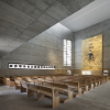 A single opaque alabaster stone-clad opening near the altar transforms the incoming western natural light into a milky, dense presence. 