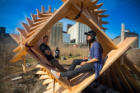 Freshman architecture students from the University at Buffalo sit inside one of the 10 structures their design studio made at Silo City as part of "Reflection Space." Photo: Douglas Levere