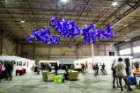Architecture faculty member Virginia Melnyk participated in the fair with a site-specific installation. "Purple," which won a People's Choice award, emerges from the ceiling as geometric star-like clusters, seeming to be expanding growing and shifting."
