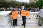 Dean Robert Shibley and Lynda Schneekloth joined protests in Buffalo's Niagara Square.