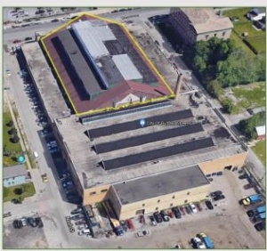 Zoom image: Aerial image of Broadway Garage in its current form, with outline of existing fabric from the original armory. 