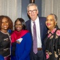 Provost Scott Weber (second from right) smiles with 2024 recipient Shawntera Hardy, MUP ’04 (second from left), who received the Distinguished Alumni Award for the School of Architecture and Planning. 