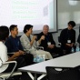 Panelists speaking in Hayes Hall. 