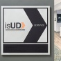 View of a hotel lobby, sign in the foreground reads, "isUD Innovative solutions for Universal Design, Certified.". 