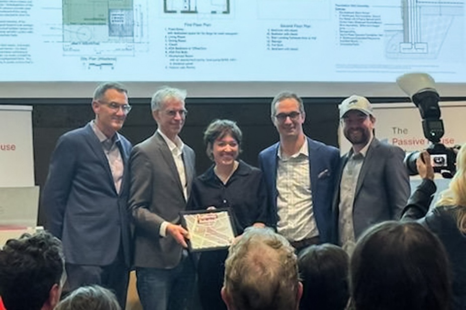 Zoom image: UB-RIT-Wendel design team members Laura Lubniewski (center), Nate Heckman (second from right) and Chris Osterhoudt (far right) accept the first-place award in the California Rebuilds: A Passive House Design Competition's Craftsman architectural style category. 