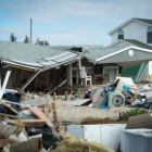 Collapsed house with trash everywhere. 
