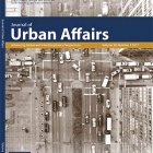 Journal cover showing street intersection with traffic. 