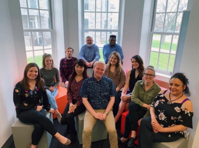 students gather for a team picture. 