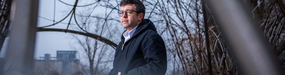 A portrait of professor Nicholas (Nick) Rajkovich, with the Department of Architecture, taken in March 2023 at Willow Way, near Silo City in Buffalo, NY. 